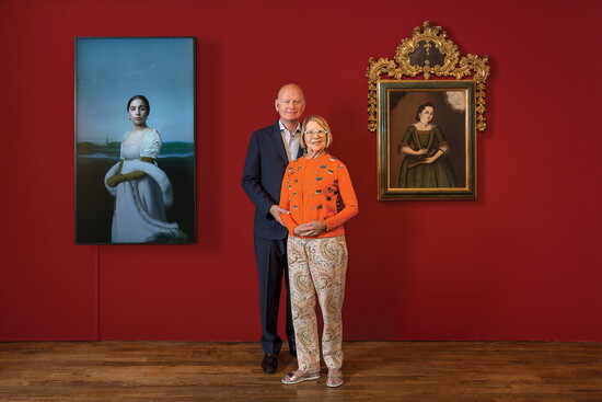 Carl and Marilynn Thoma with (from left) Robert Wilson's Lady Gaga: Mademoiselle Caroline Rivière, 2013, and Andrés Solano's Portrait of Ana Josepha de Castañed
