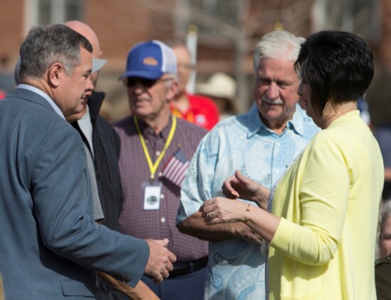 Former mayor, Jon Pike, and current mayor, Michele Randall, greet attendees at the Gold Star Families Memorial Monument dedication