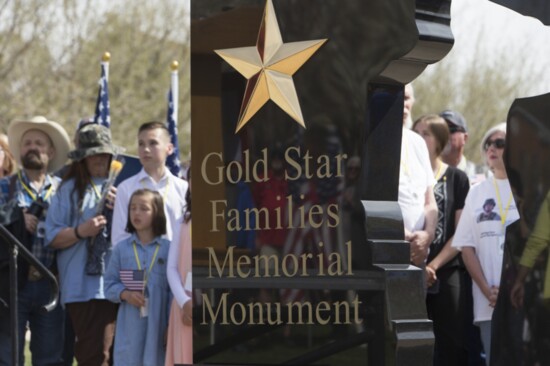 Gold Star families and supporters surround the new memorial at the dedication ceremony in St. George 