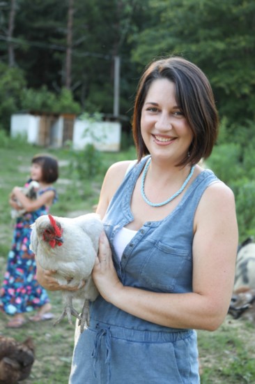 Kimberly holds one of her egg laying hens