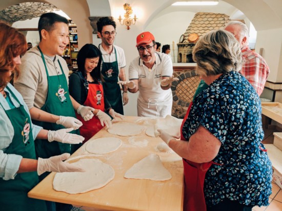 Heart of Italy travelers learning to make homemade pizza from a Chef in Sorrento, Italy.