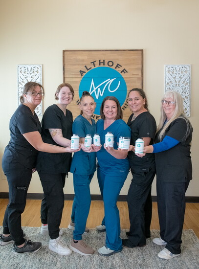 Members of the Althoff Wellness Clinic team with Dr. J and Dr. Jill Althoff, DC.