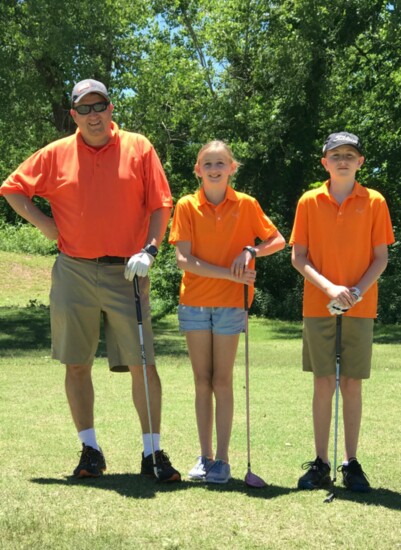 Eugene Bertman; daughter Audrey; and son Joshua enjoy some family time together at The Trails Golf Club.