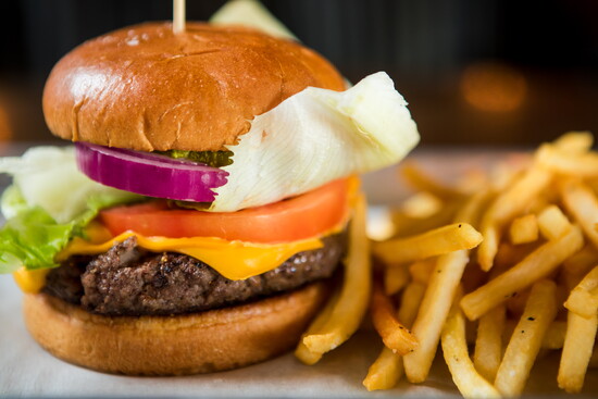 Moon Dog Grub & Pub offers a generous half-pound burger with all the fixins.