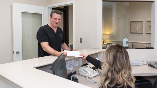 Dr. Joseph Lota at the front desk