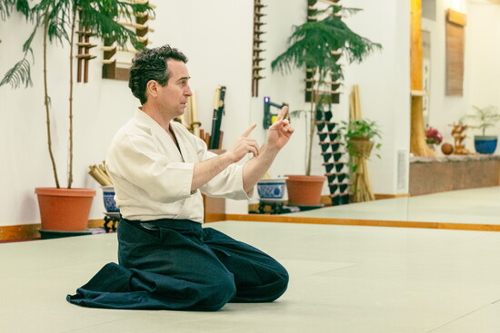 Aaron Cass gives some instruction before class starts 