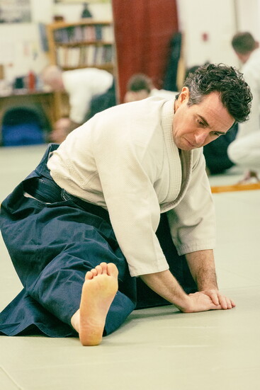 tretching and centering before practice at the Portsmouth Aikido Dojo