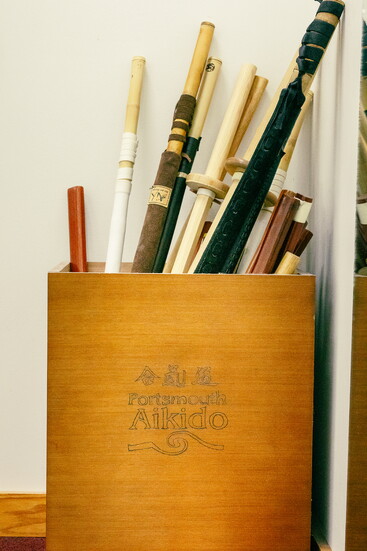 A collection of Aikido training weapons waiting for practice at Portsmouth Aikido