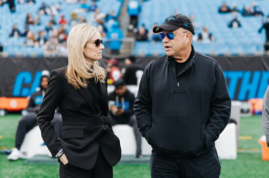 Coleman with David Tepper, owner of the Carolina Panthers and Charlotte FC.