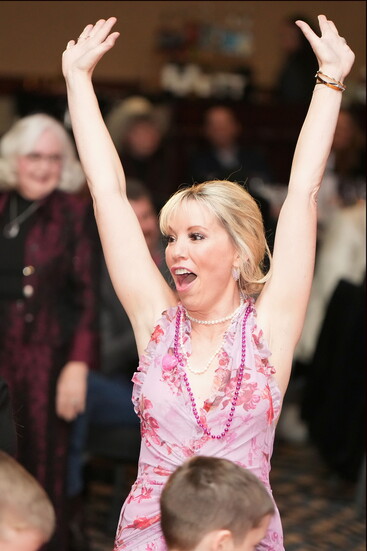 The Inimitable Rebecca Smith Celebrating at a Love Heals Youth Gala.