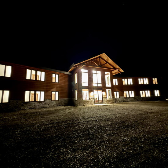 The Retreat, all lit up at night. 