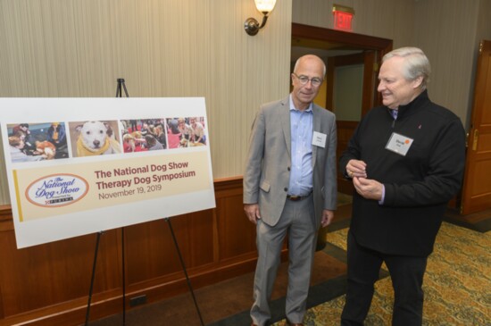 David Frei (right) and former Pet Product News publisher Steve LeGrice discuss inaugural National Dog Show Therapy Dog Symposium. Photo credit: Rowan University