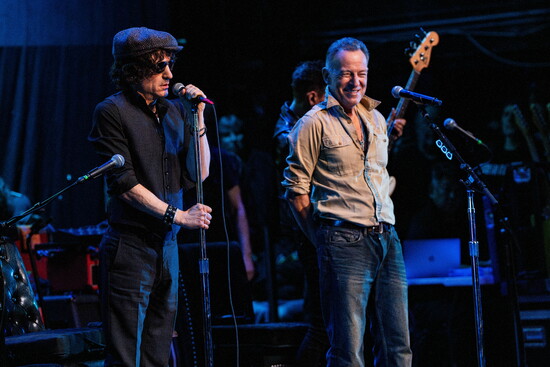 It's a living room scene with Bruce Springsteen and Jesse Malin bantering