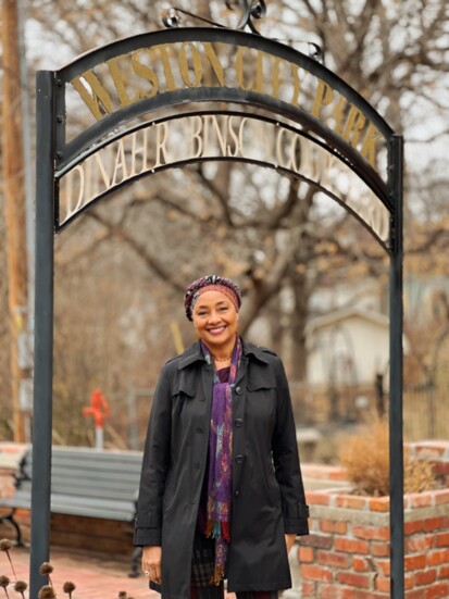 Angel Hagenbach in front of the courtyard named for her ancestor, Dinah Robinson