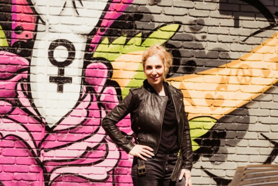 Anne by the Weverson mural on her storefront. (Photo: Stefanie Cole Photography)