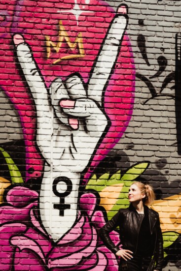 Anne by the Weverson mural on her storefront. (Photo: Stefanie Cole Photography)