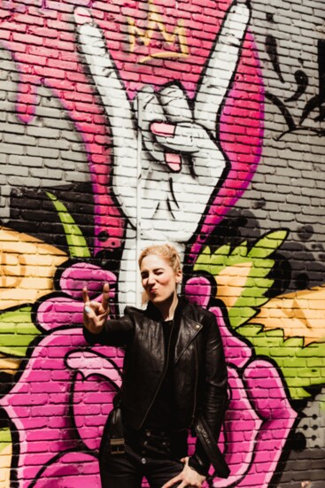 Anne by the Weverson mural on her storefront. (Photo: Stefanie Cole Photography)