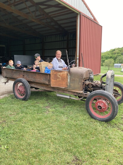 Cody's father, Jim, driving a 1929 Model A pick-up