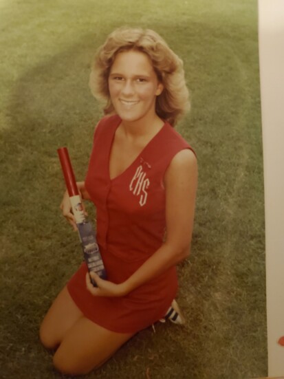 Cindy as a young cheerleader 