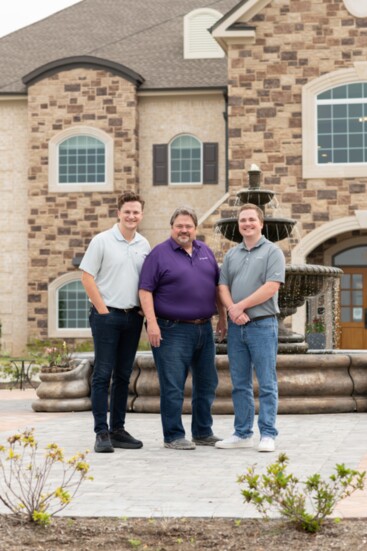 Noble, Curtis, and Justin Lindsey stand in front of Wothington Manor Senior Living-one of their designs in Conroe. 