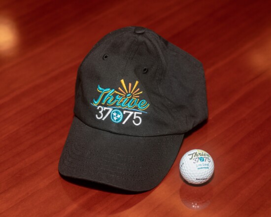 Ball caps and golf balls with the Thrive logo are available now.