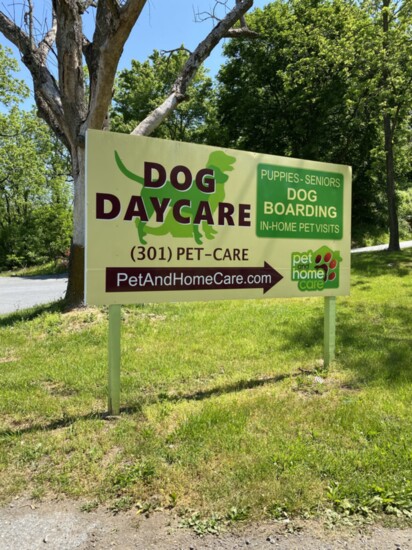 A sign marks the entrance to the Pet and Home Care dog resort in Clarksburg. 