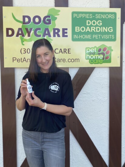 Tiffany Lewis, owner of Pet and Home Care dog resort shows her newest product, a pet hemp oil called The Pleasant Pet.