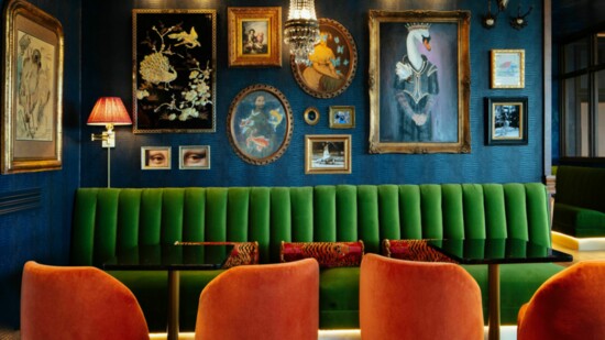 Tiger and Peacock has a moody atmosphere full of rich textures, vibrant colors, crystal chandeliers and brass accents.