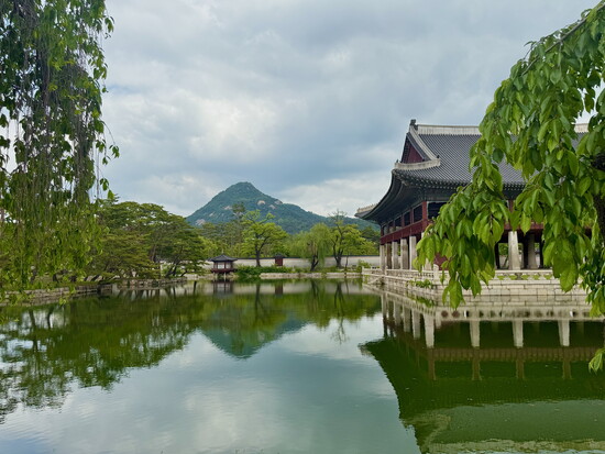 The Virtuous Meeting Building is an elevated hall located on an island inside the palace compound of Gyeongbokgung.