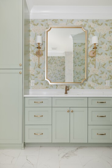 Warm gold tone finishes with classic wallpaper provides timeless appeal.