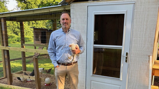 Eric Foster, CFP®, CPA with one of his hens