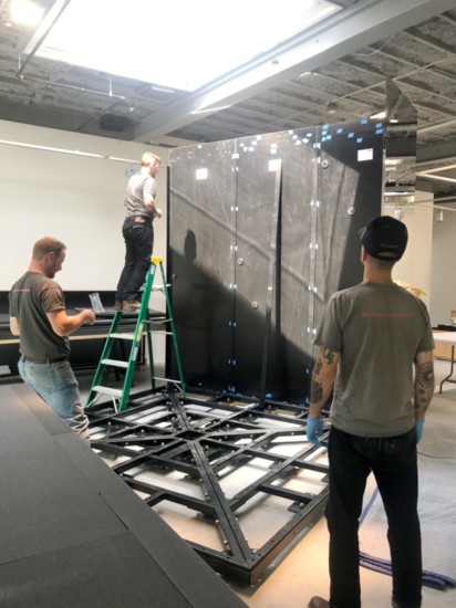 Working on the walls.  (photo: Courtesy MoCA Westport)