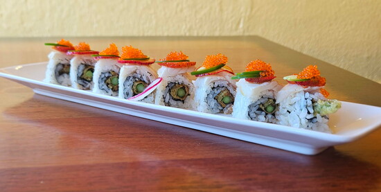 Jala-Berry: Tempura asparagus, mint, sriracha, fresh strawberry, topped with torched escolar, thin sliced jalapeño, ponzu, and tobiko caviar.