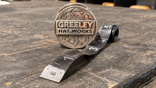 The Silver Tape Measure Holder