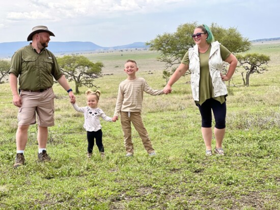 Leah and her family on the Serengeti on Safari in Tanzania.
