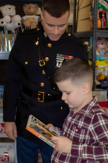 Toys for Tots Literacy Program helps to put new books in the hands of a child.