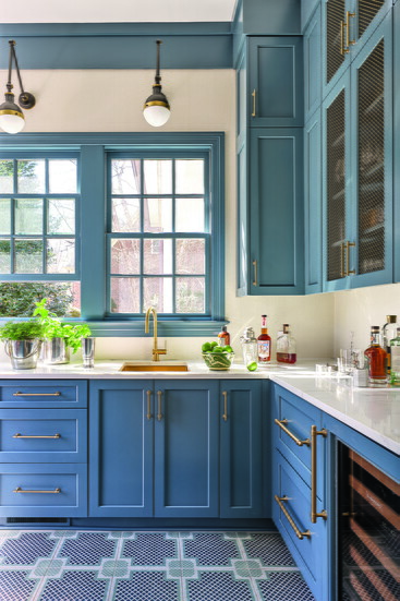 The scullery cabinets are painted in Sherwin-Williams’ Waterloo, a deep, moody blue with gray undertones. 