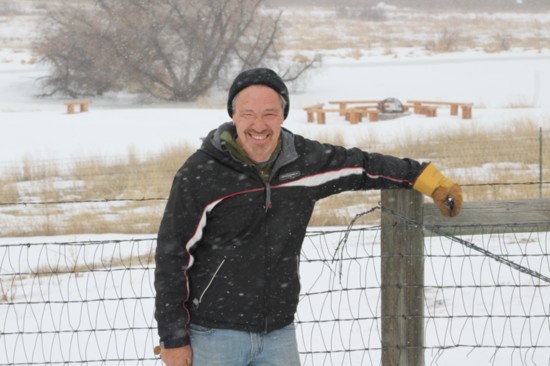 Brian O'Malley braves the wind and snow to volunteer at Prairie Canyon Ranch