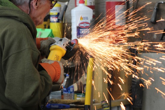 Volunteers sharpen dozens of tools in preparation to build Douglas County's newest trail system