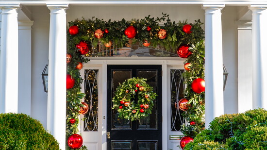 When buying garland for your front door, Lugibihl recommends buying enough to go around the frame two or three times for a lush, full look that makes a lasting