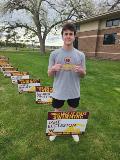 Jake in front of his sign on Main St.  in front of the district office.