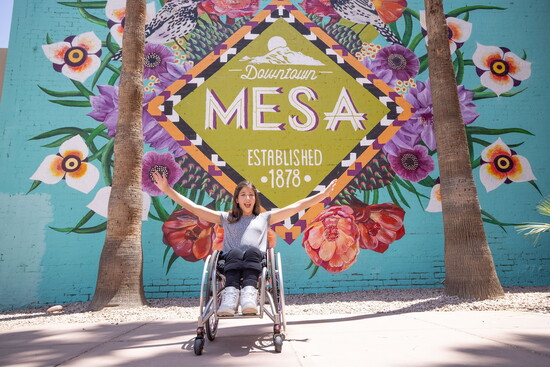 Girl in front of Downtown Mesa Mural