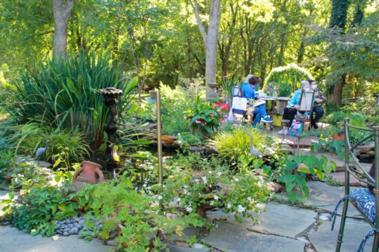 Tulsa Garden Club board members enjoy lunch and a meeting in the beautiful gardens of member Linda Newton