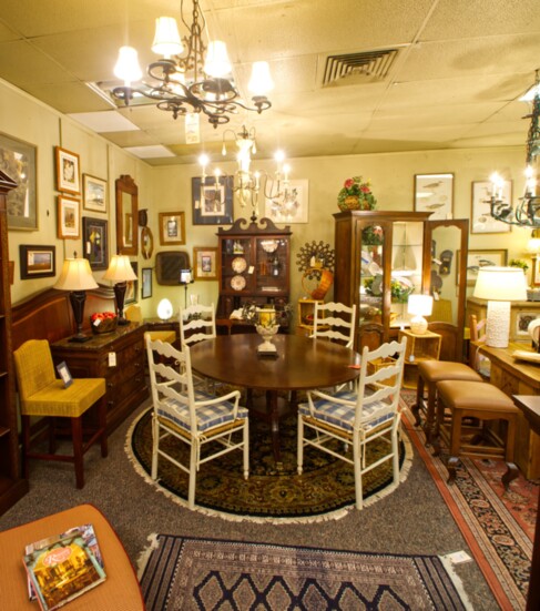 Farmhouse dining chairs can be paired with a more traditional table for a fusion of styles. 