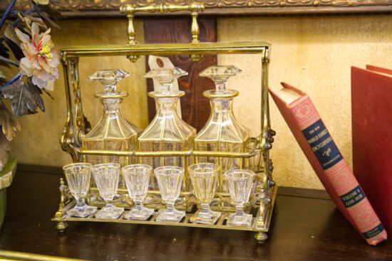 A set of art deco decanters and shot glasses ready for display in a home bar.