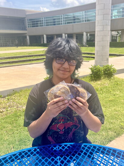 Jordan Duran, 11th grade, showcases a variety of homemade cookies. 