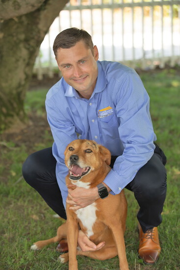 Eric Bowser with his dog, Scarlett. Photo Credit: Kerry Paradis Photography