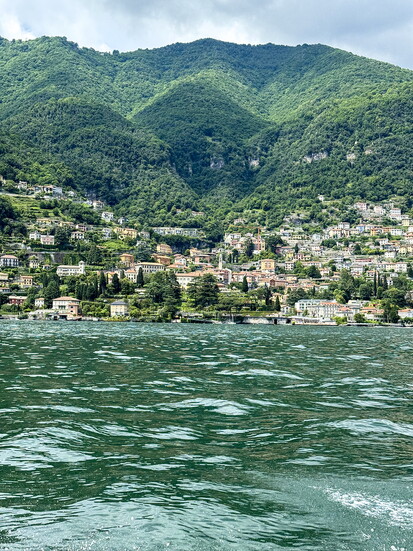 Approaching the town of Bellagio, situated on Lake Como and framed by the majestic Alpine range  