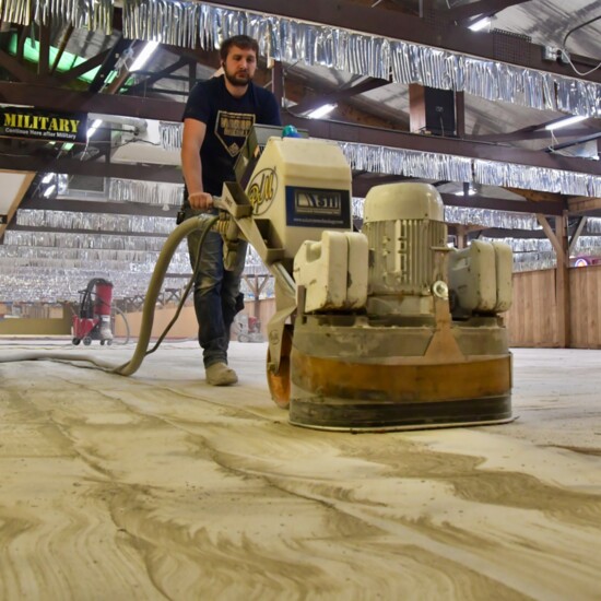 Prepping the flooring before application.