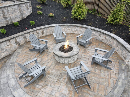 A beautiful outdoor seating area with a firepit